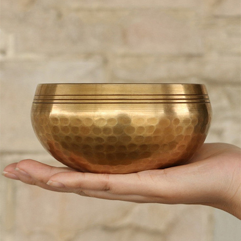 Tibetan singing bowl, bronze chime and its mallet