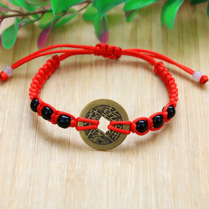 Bracelet pour attirer l'abondance en corde rouge tissé à la main avec des pièces de cuivre