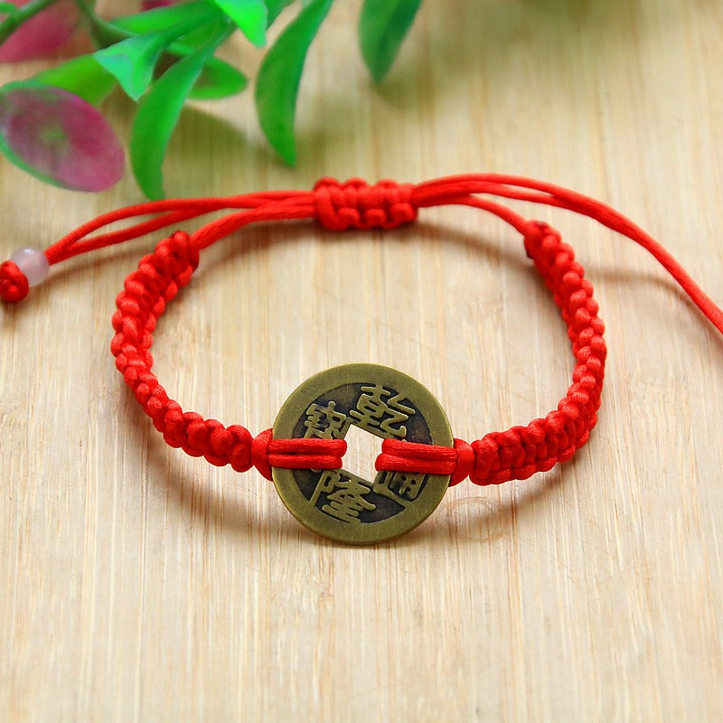 Bracelet pour attirer l'abondance en corde rouge tissé à la main avec des pièces de cuivre