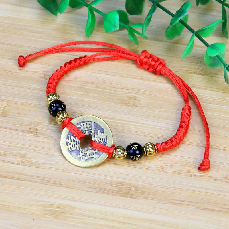 Bracelet to attract abundance in red rope hand-woven with copper coins