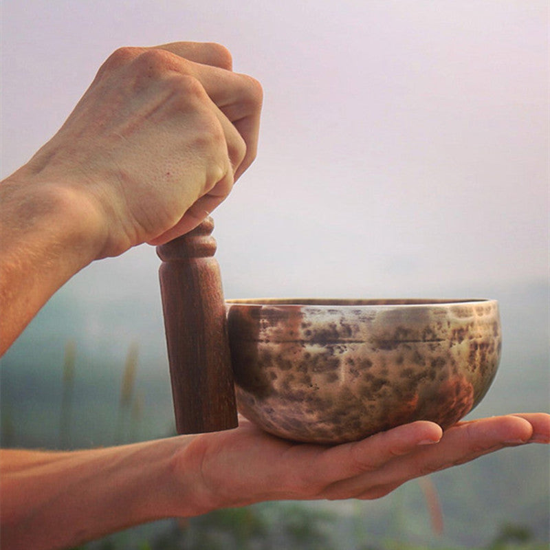 Tibetan singing bowl, bronze chime and its mallet