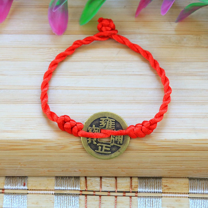 Bracelet pour attirer l'abondance en corde rouge tissé à la main avec des pièces de cuivre