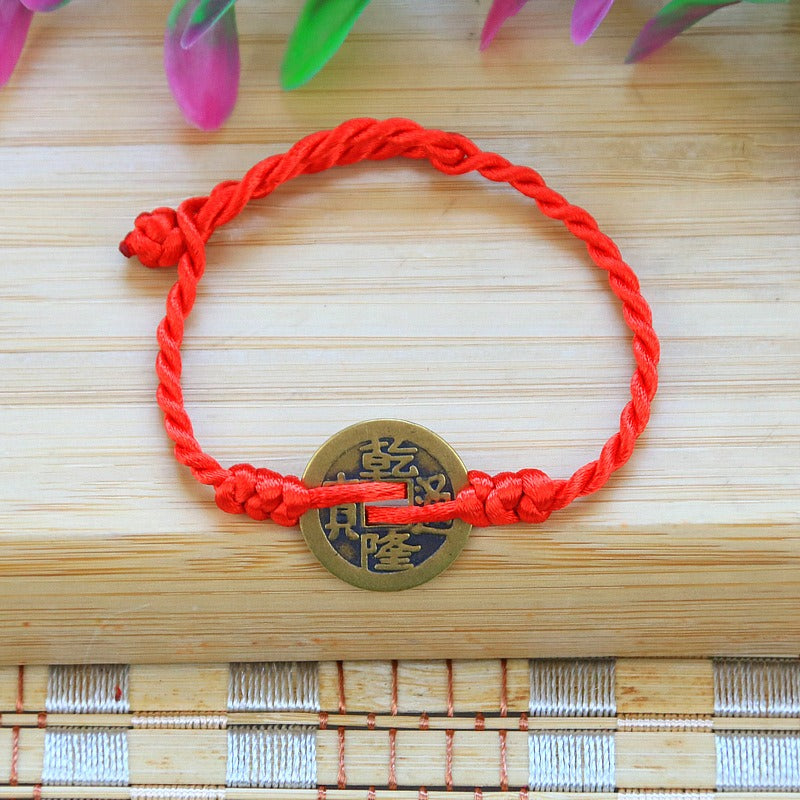 Bracelet to attract abundance in red rope hand-woven with copper coins