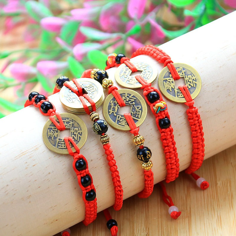 Bracelet to attract abundance in red rope hand-woven with copper coins