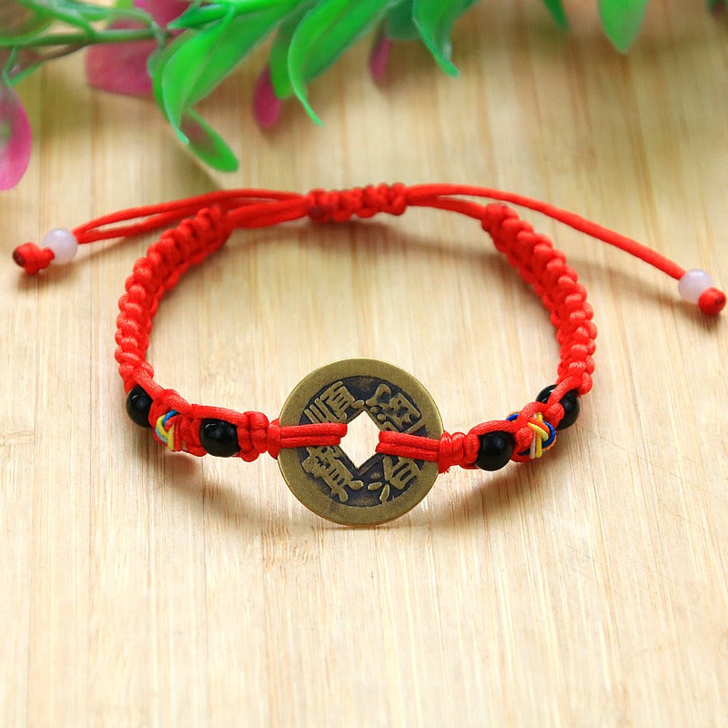 Bracelet pour attirer l'abondance en corde rouge tissé à la main avec des pièces de cuivre