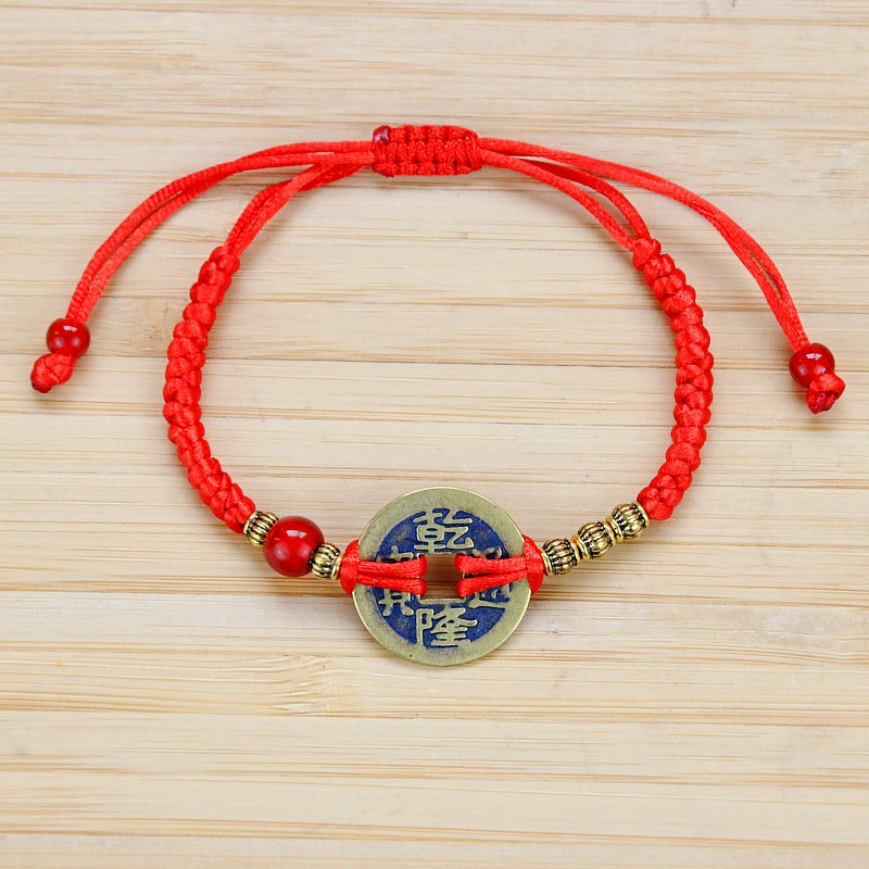 Bracelet pour attirer l'abondance en corde rouge tissé à la main avec des pièces de cuivre