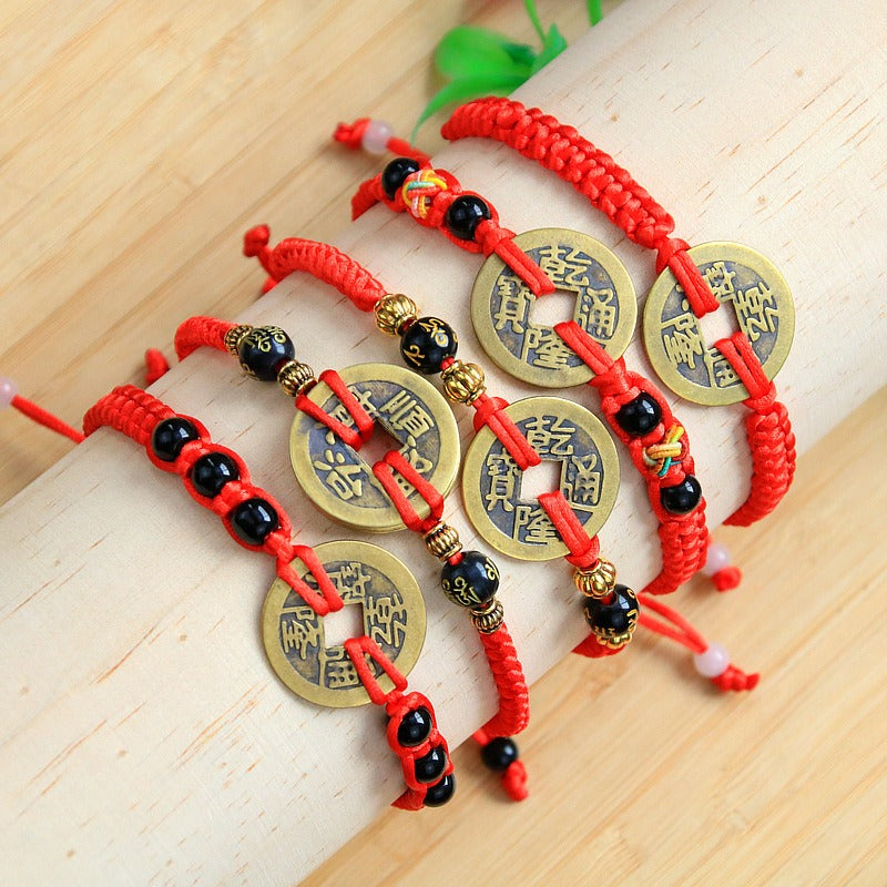 Bracelet to attract abundance in red rope hand-woven with copper coins